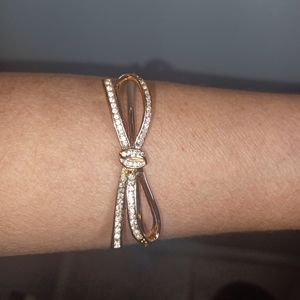 White Crystal Gold Tone Bow Slide Bracelet